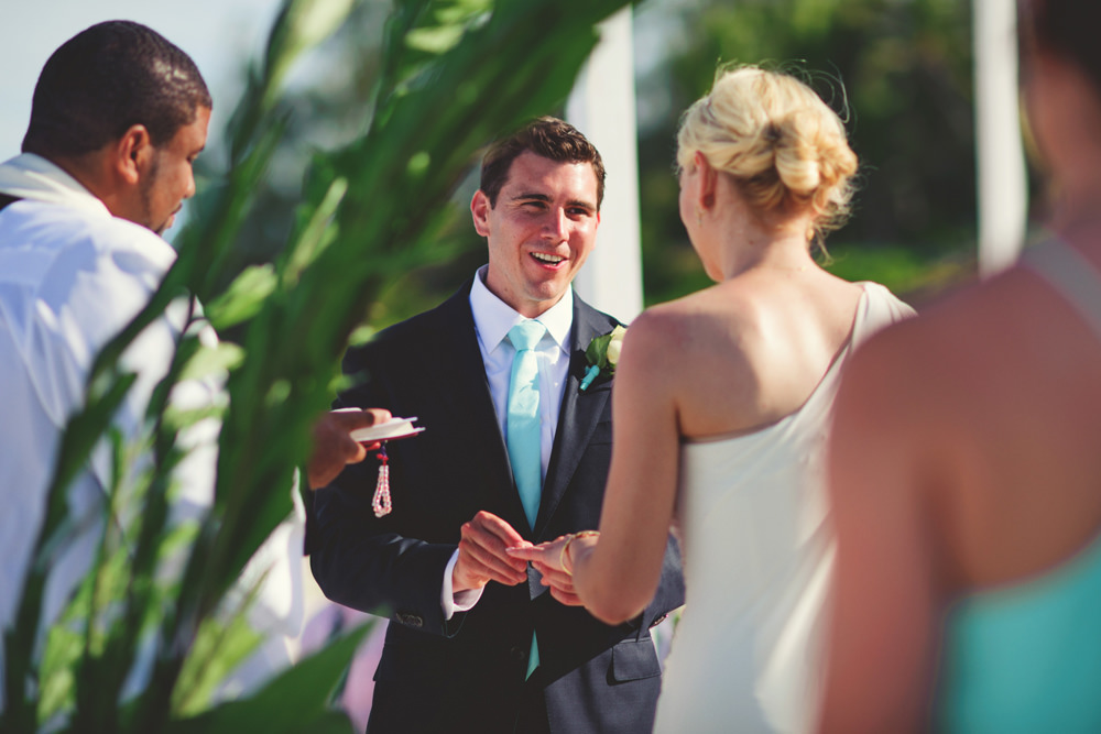 ocean view club wedding : groom putting on ring