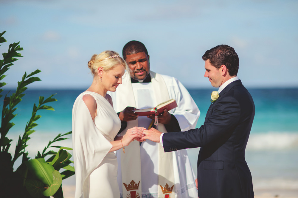 ocean view club wedding : bride putting on ring