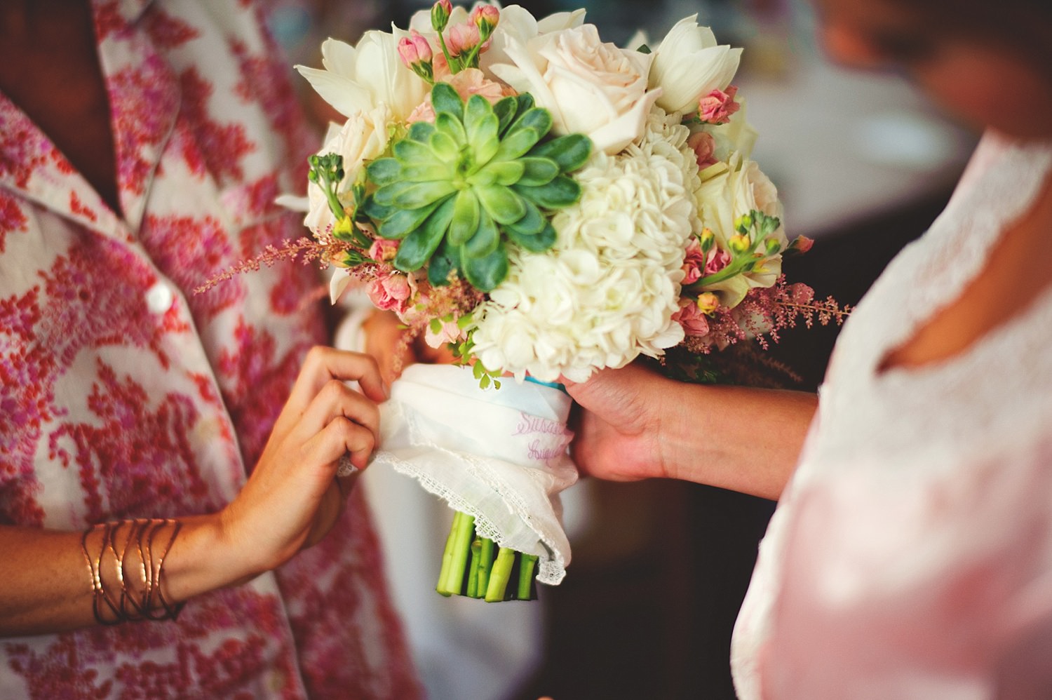 pierre's restaurant wedding: putting handkerchief on bouquet  