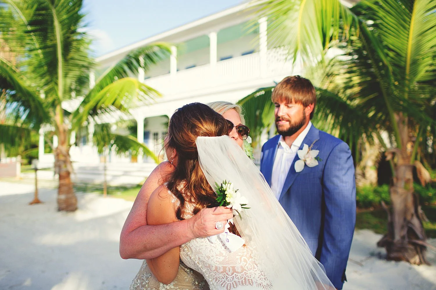 pierre's restaurant wedding: bride hugging family