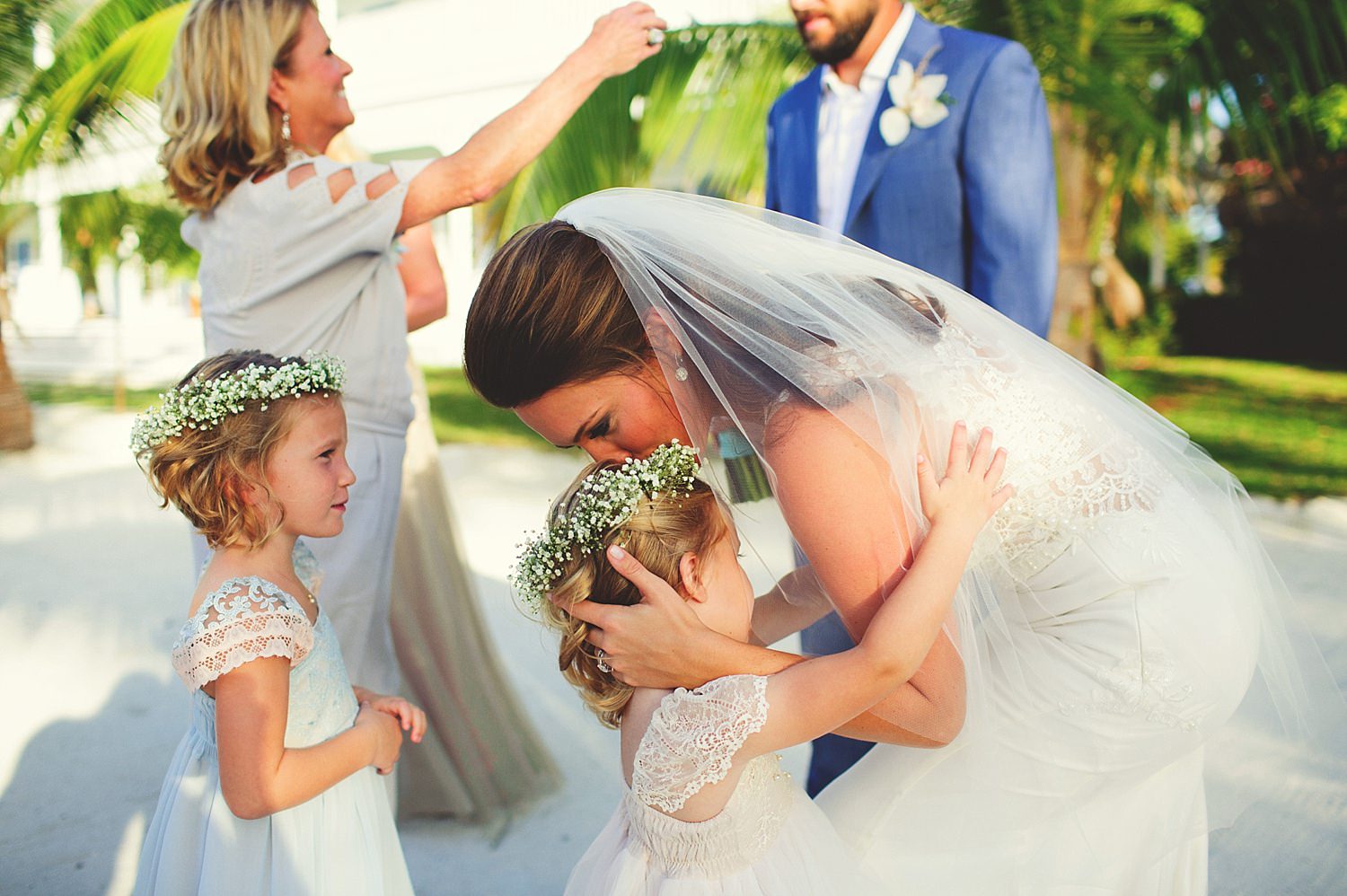 pierre's restaurant wedding: bride kissing flower girls