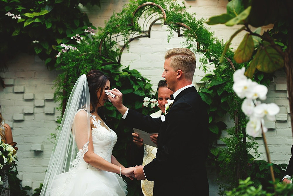 groom wiping a tear away