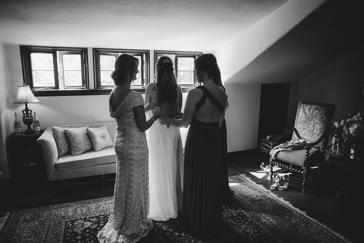 casa feliz wedding photos: bride putting on wedding dress