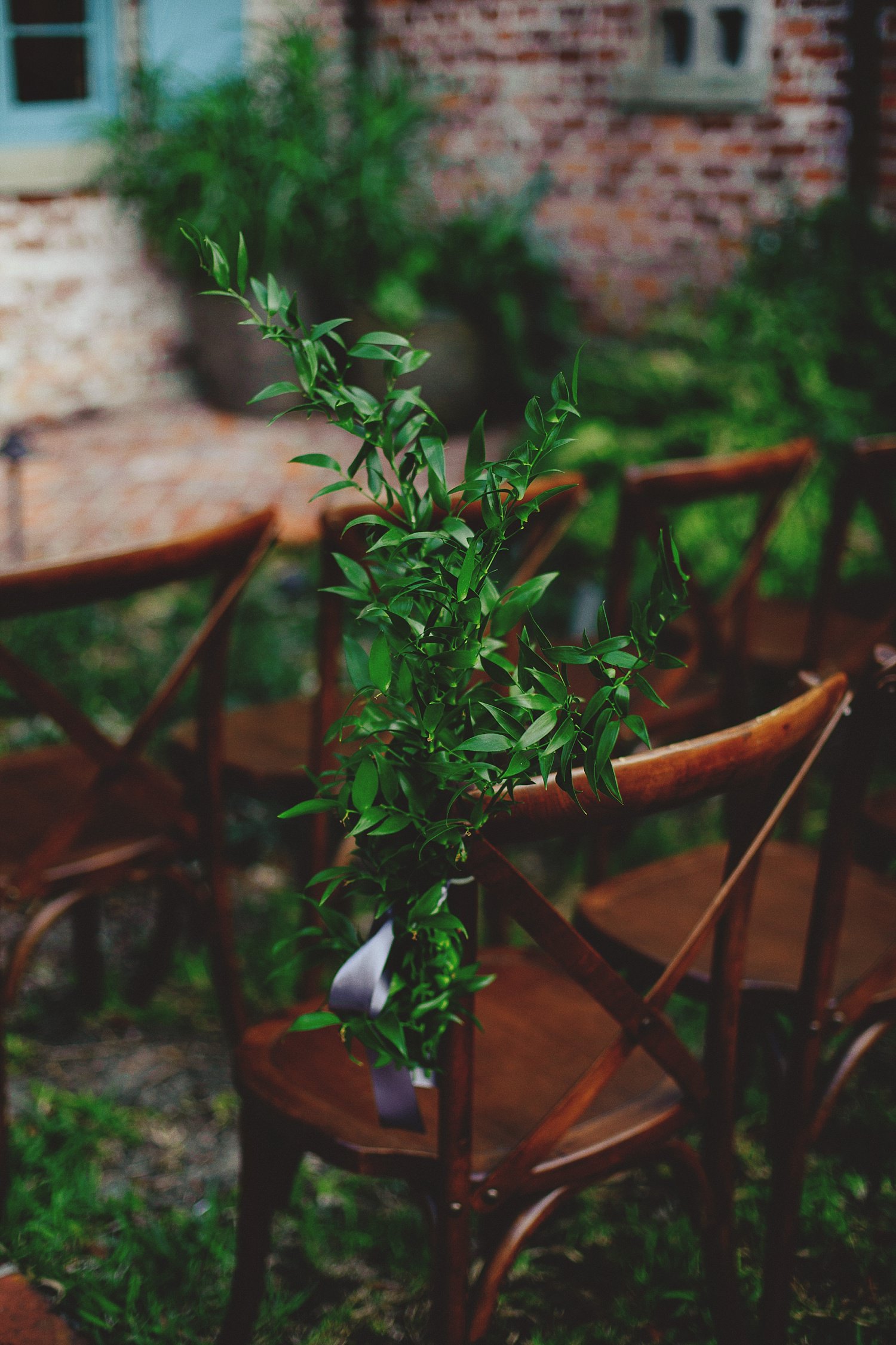 casa feliz wedding photos: greenery on chairs