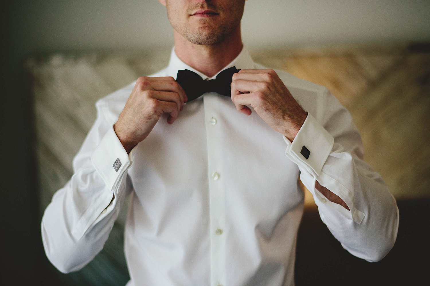 romantic-w-fort-lauderdale-wedding: groom straighting bow tie