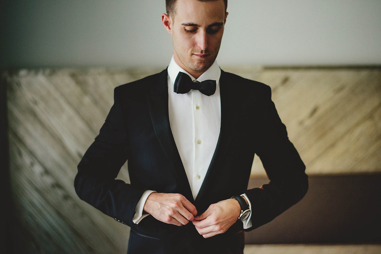 romantic-w-fort-lauderdale-wedding: groom buttoning jacket
