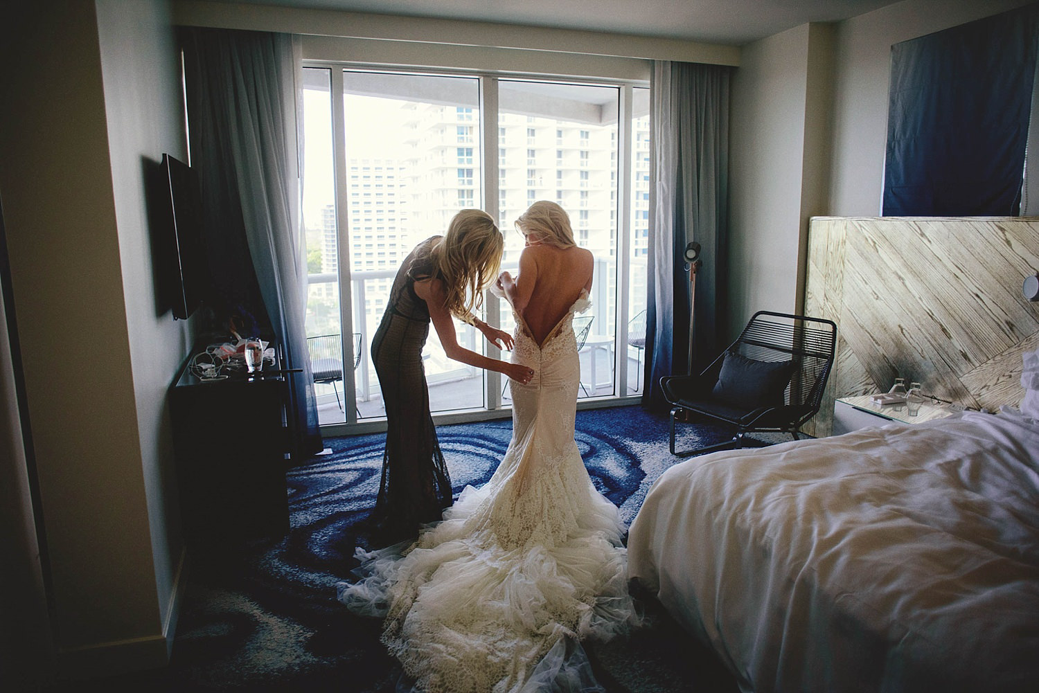 romantic-w-fort-lauderdale-wedding: bridal putting on dress