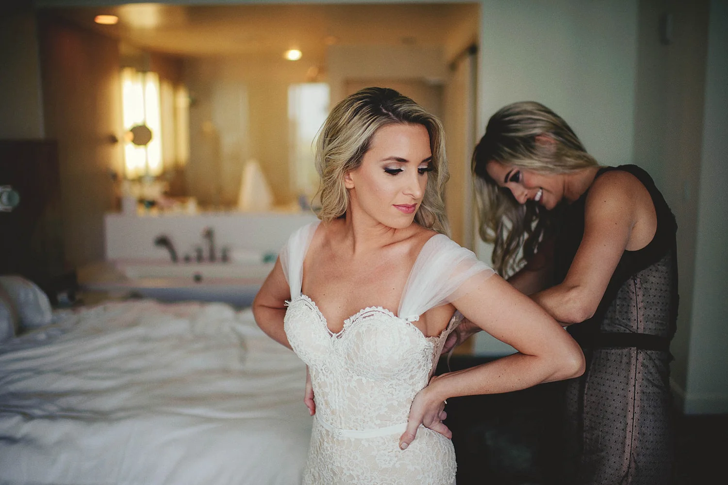 romantic-w-fort-lauderdale-wedding: bridesmaid helping bride wit