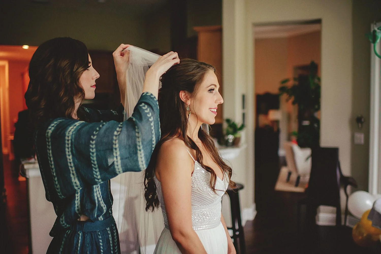 knowles memorial chapel wedding: bride getting veil put in