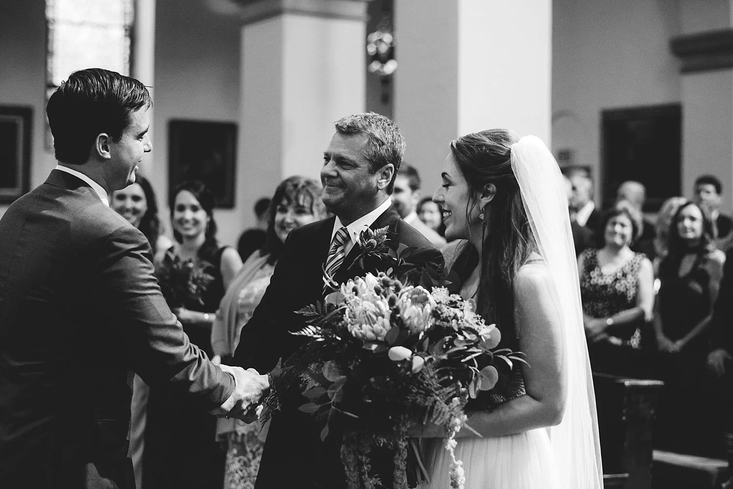 knowles memorial chapel wedding: father of bride shaking grooms