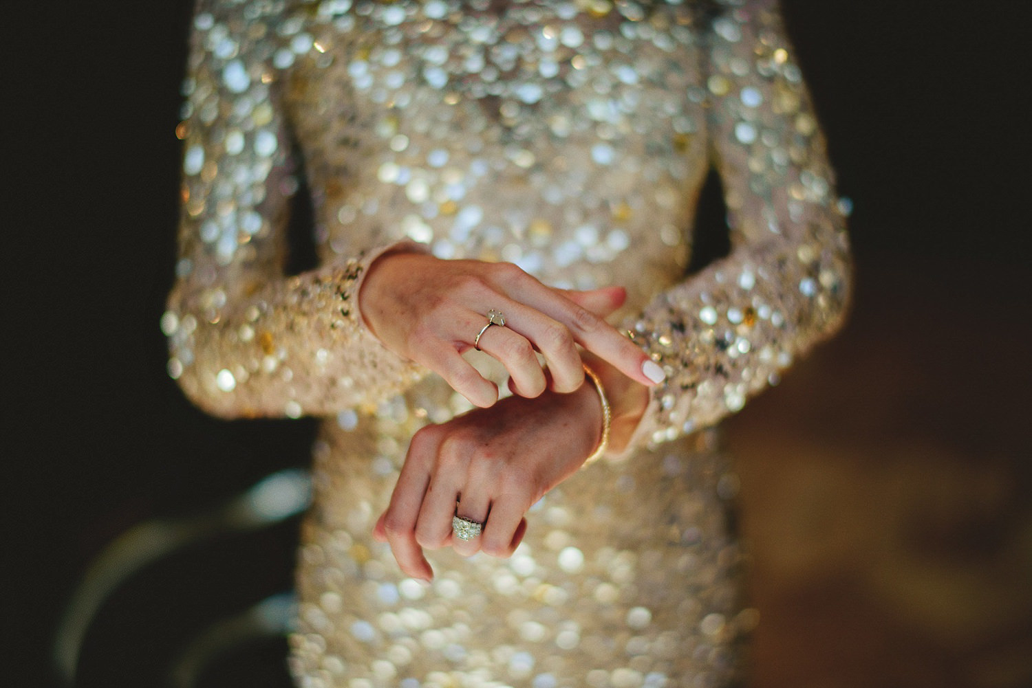 bride putting on bracelets 