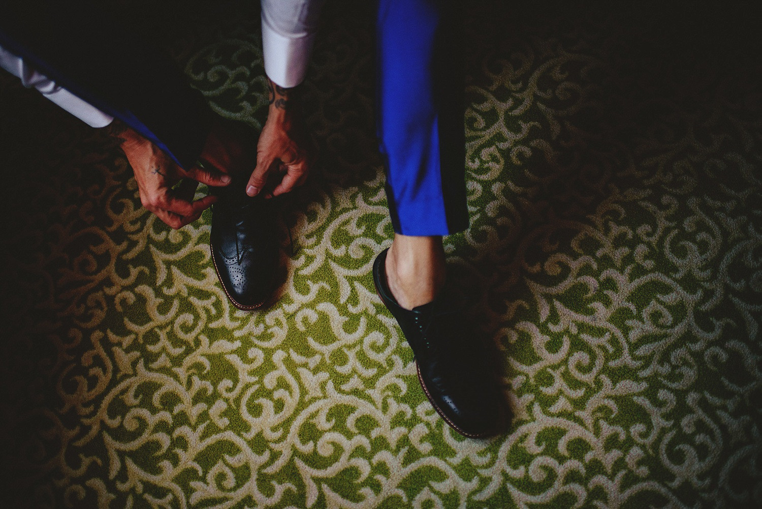 groom putting on shoes