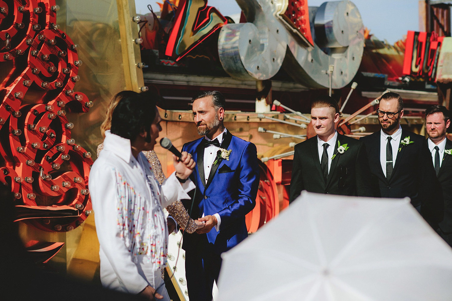 neon museum wedding - groom saying vows