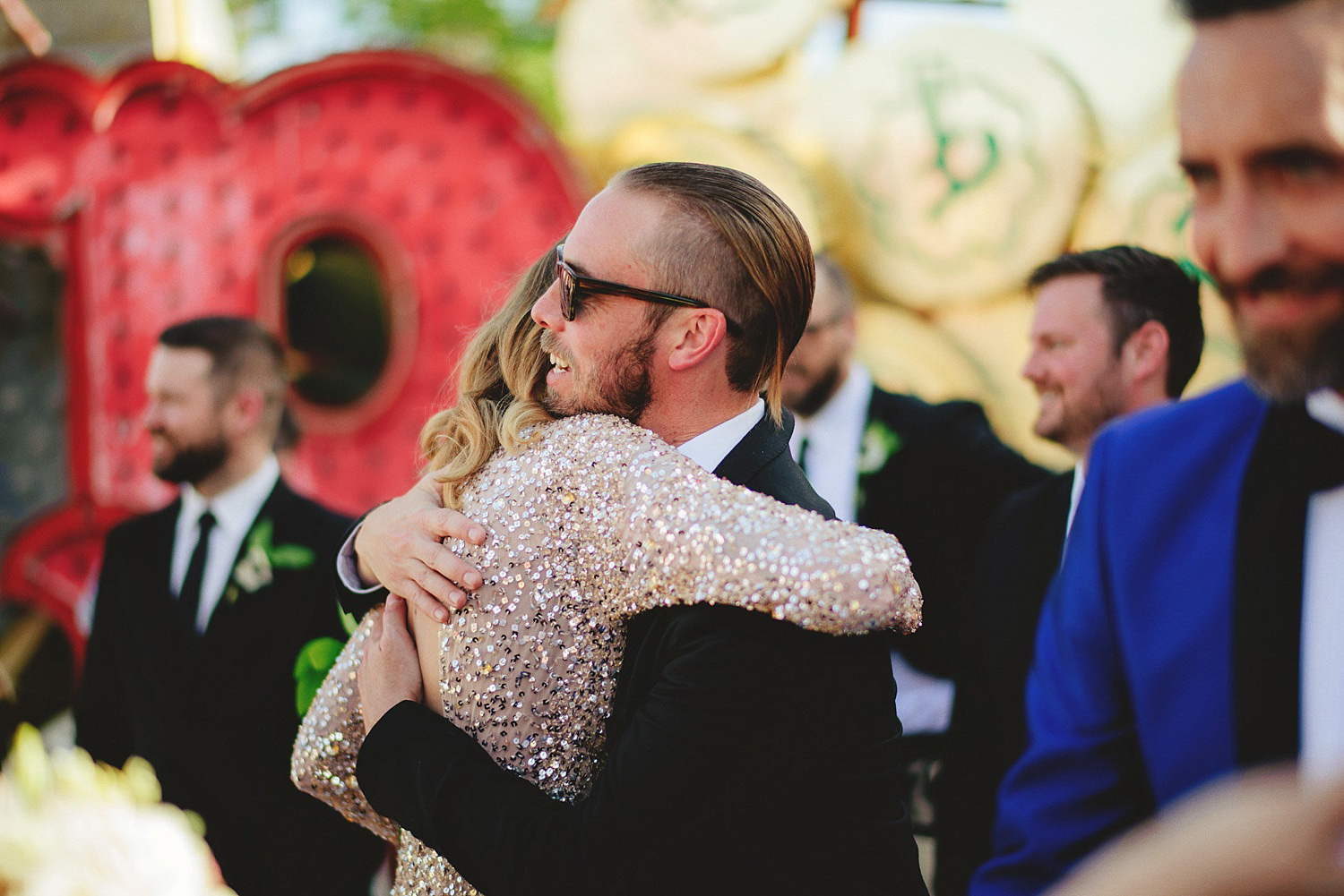 neon museum wedding - hugging after ceremony