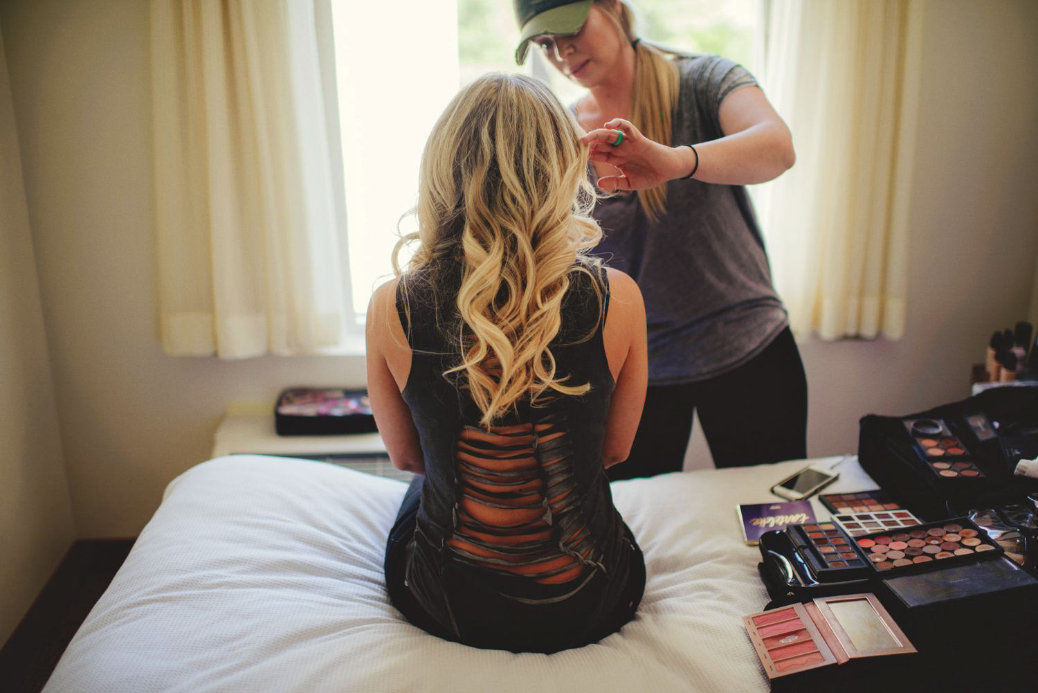 editorial ringling wedding: bride getting makeup done