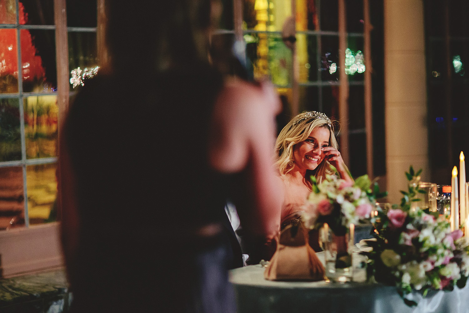 editorial ringling wedding: bride crying from maid of honor spee