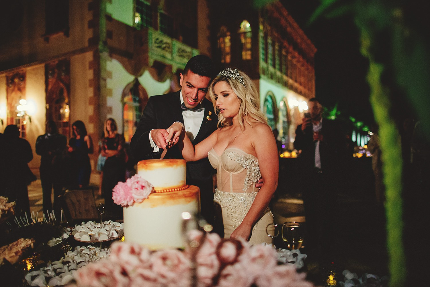 editorial ringling wedding: bride and groom cutting cake