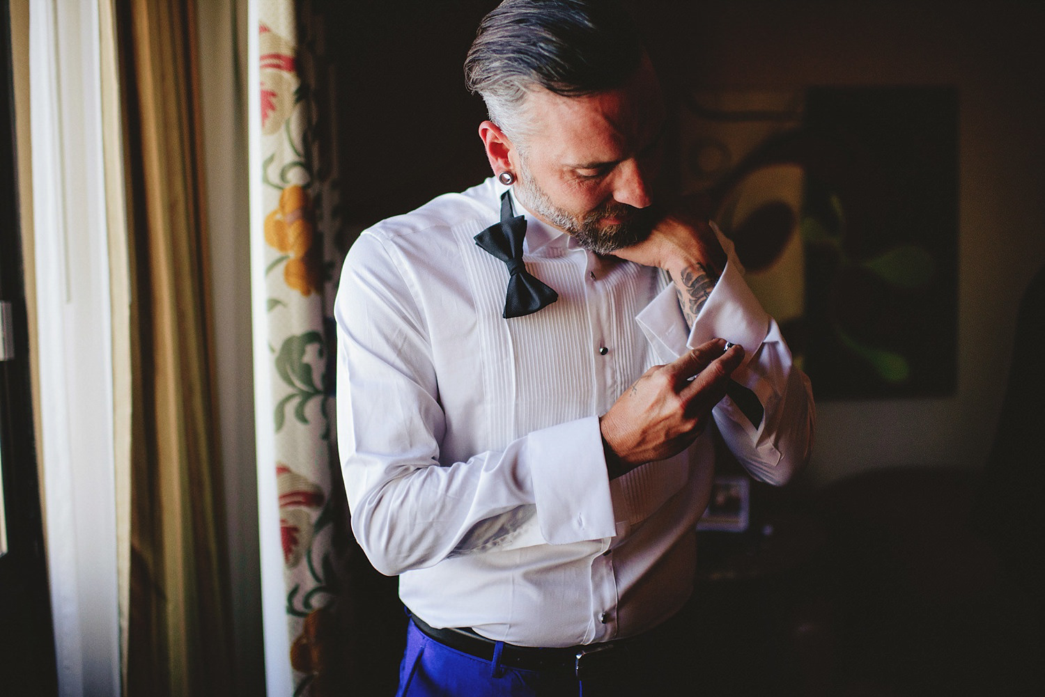 grooom putting on cufflinks