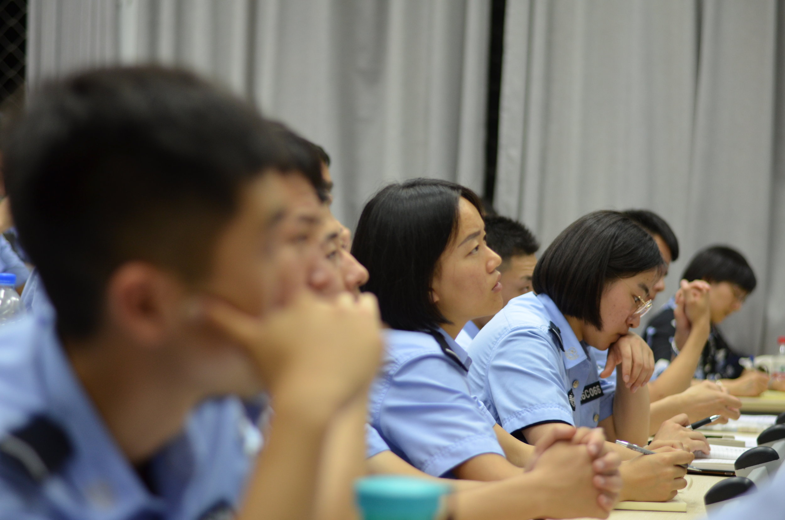 Students at People's Public Security University listening attentively