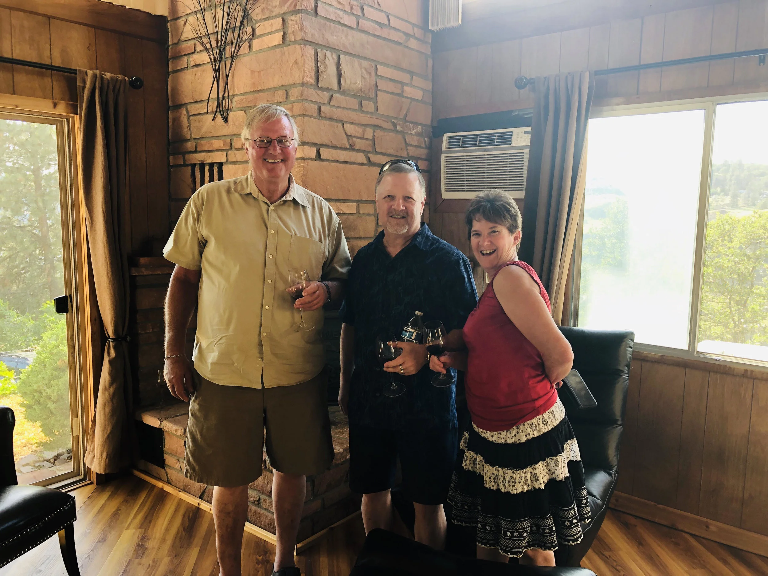 Dad Keith, Gary, and Susan sharing Harley stories and Charbono