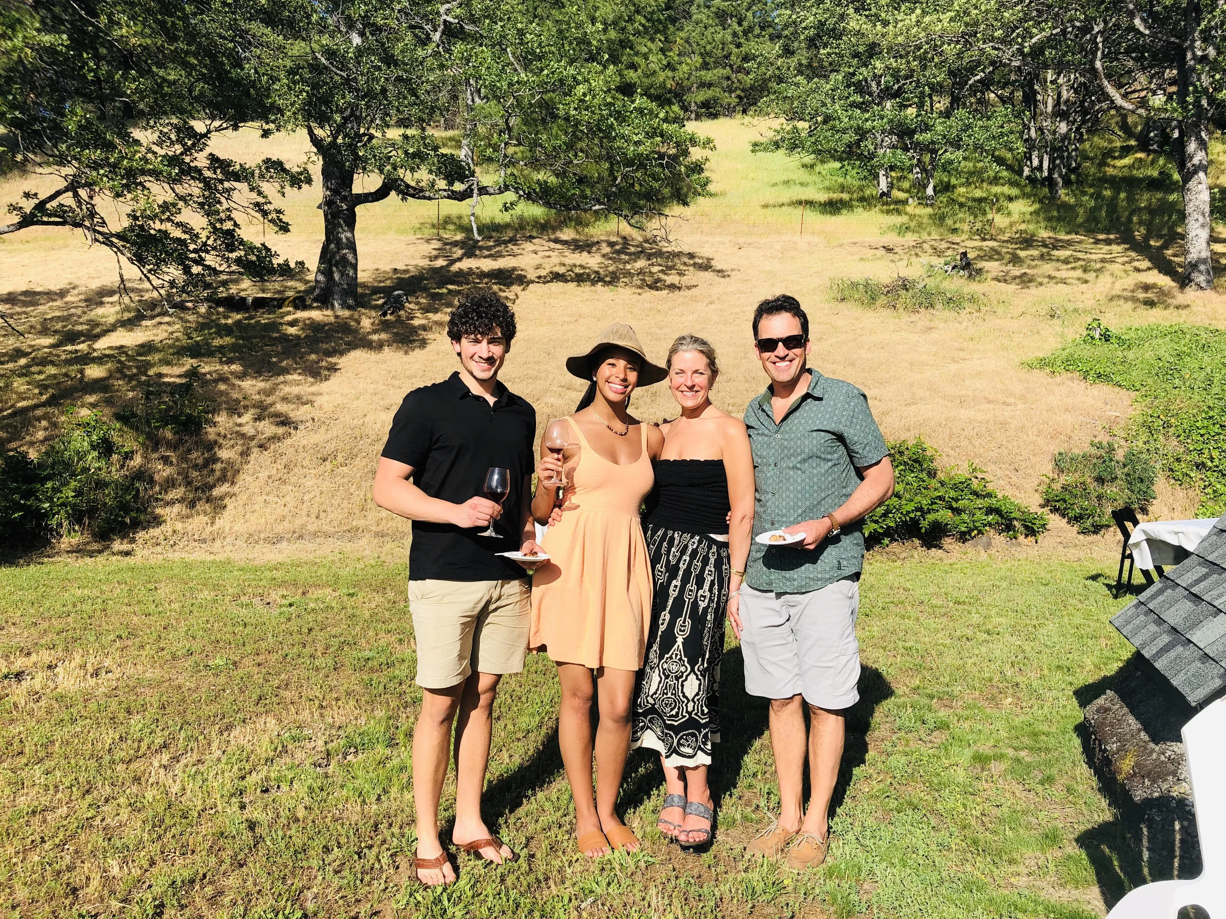 Nick, Paige, Heidi, and Gary enjoying food and wine