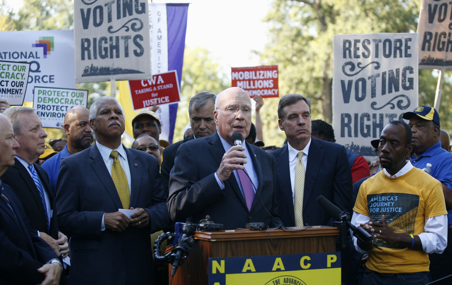  Senator Patrick Leahy, D-Vt., center, speaks during a news conference on Capitol Hill in support of a fix to the Voting Rights Act. (AP Photo / Lauren Victoria Burke)