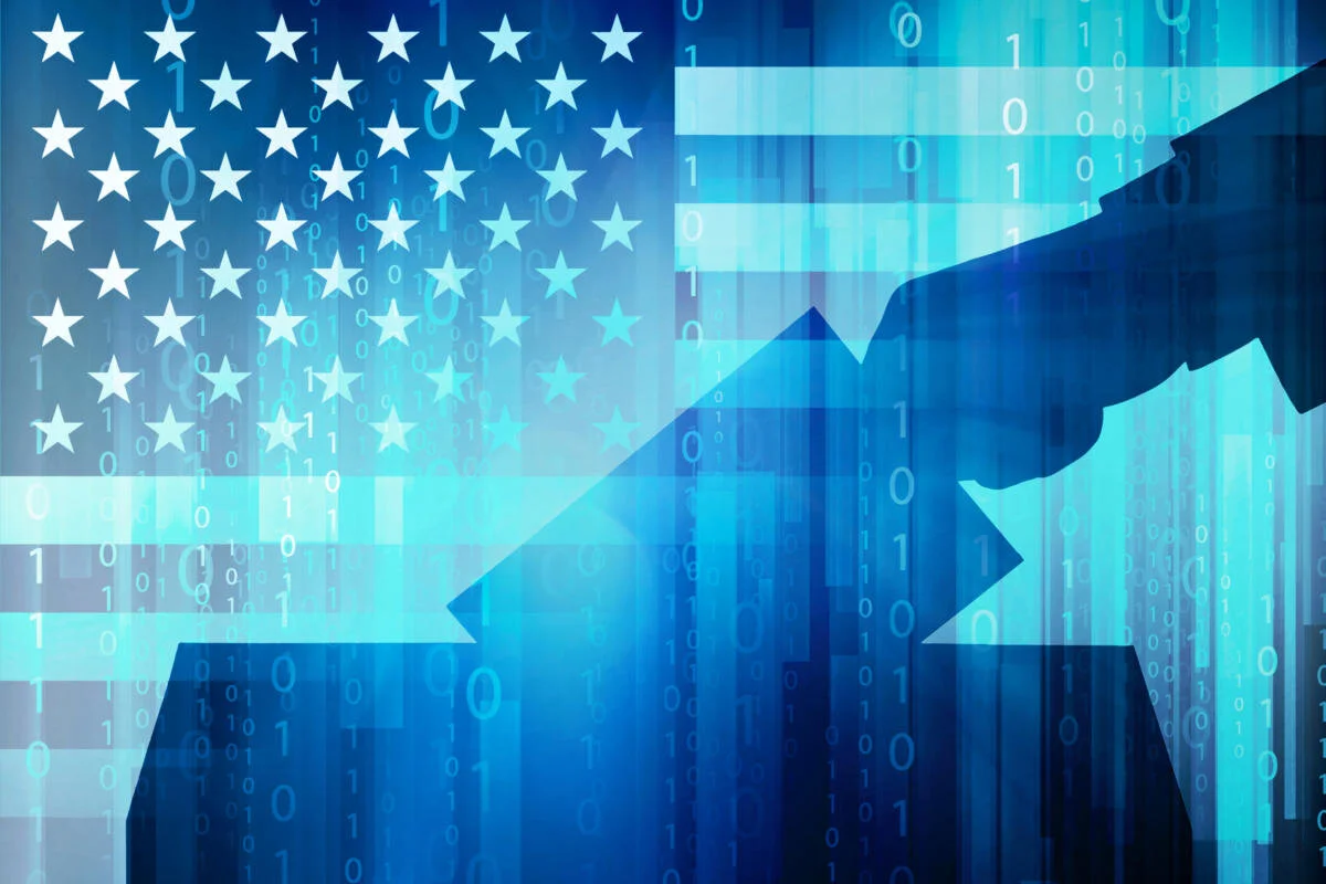 cso_election_security_vulnerability_hack_concept_backlit_hand_vote_ballot_box_by_jcrosemann_gettyimages-499191723_usa_united_states_flag_binary_code_by_traffic_analyzer_gettyimages-646068048_2400x1600-100801406-large (1).jpg
