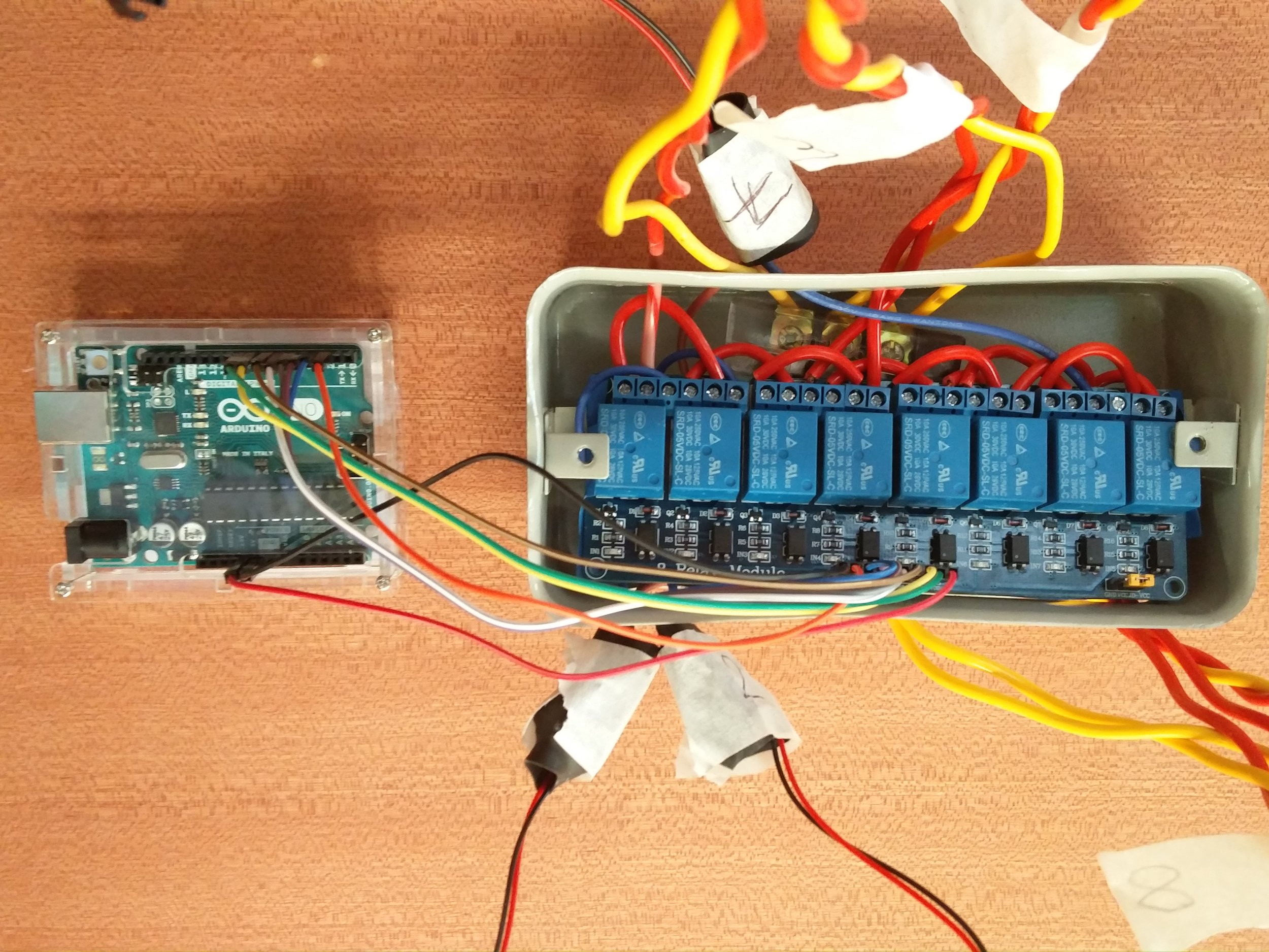 The assembled setup fixed on the ceiling: Arduino and wired relay board