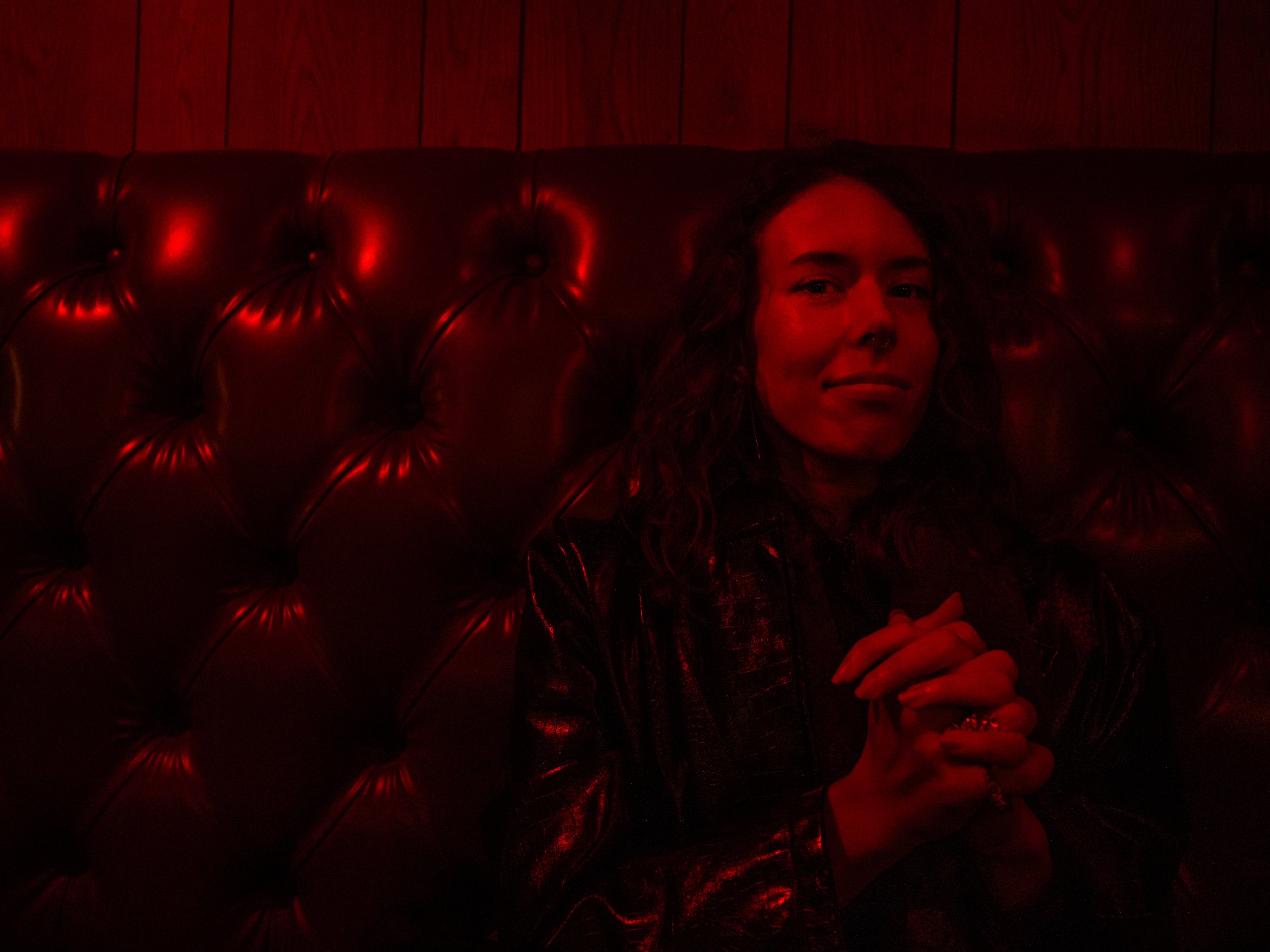  Amelia Foster sits inside a bar in Manhattan. 