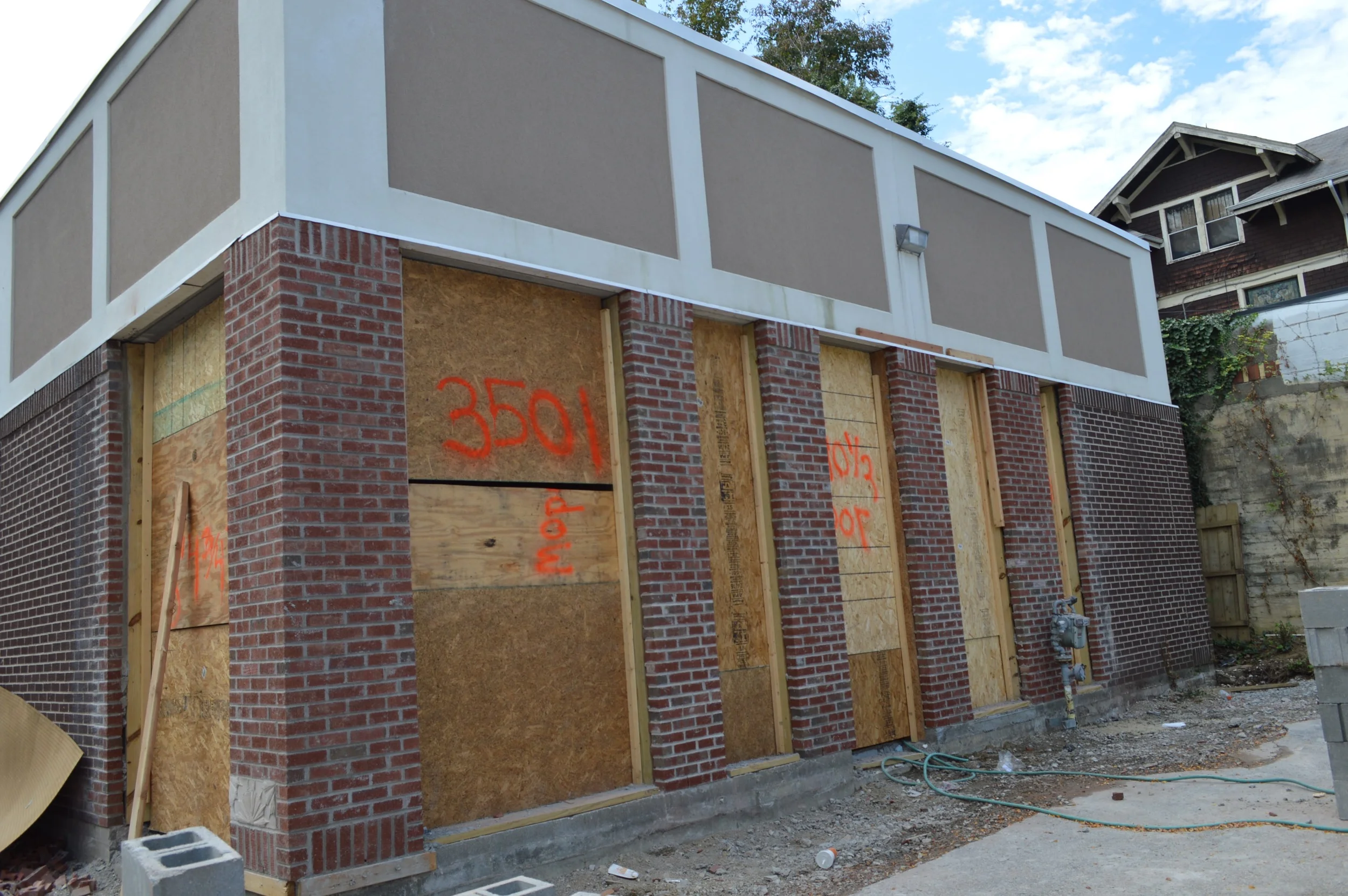 Beginning to open the opaque facade enfronting Erie Avenue.