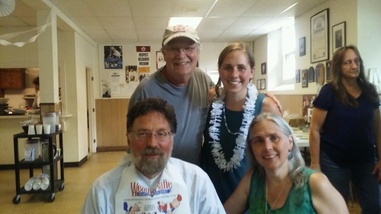 Ariele with her godfather, father, and mother.