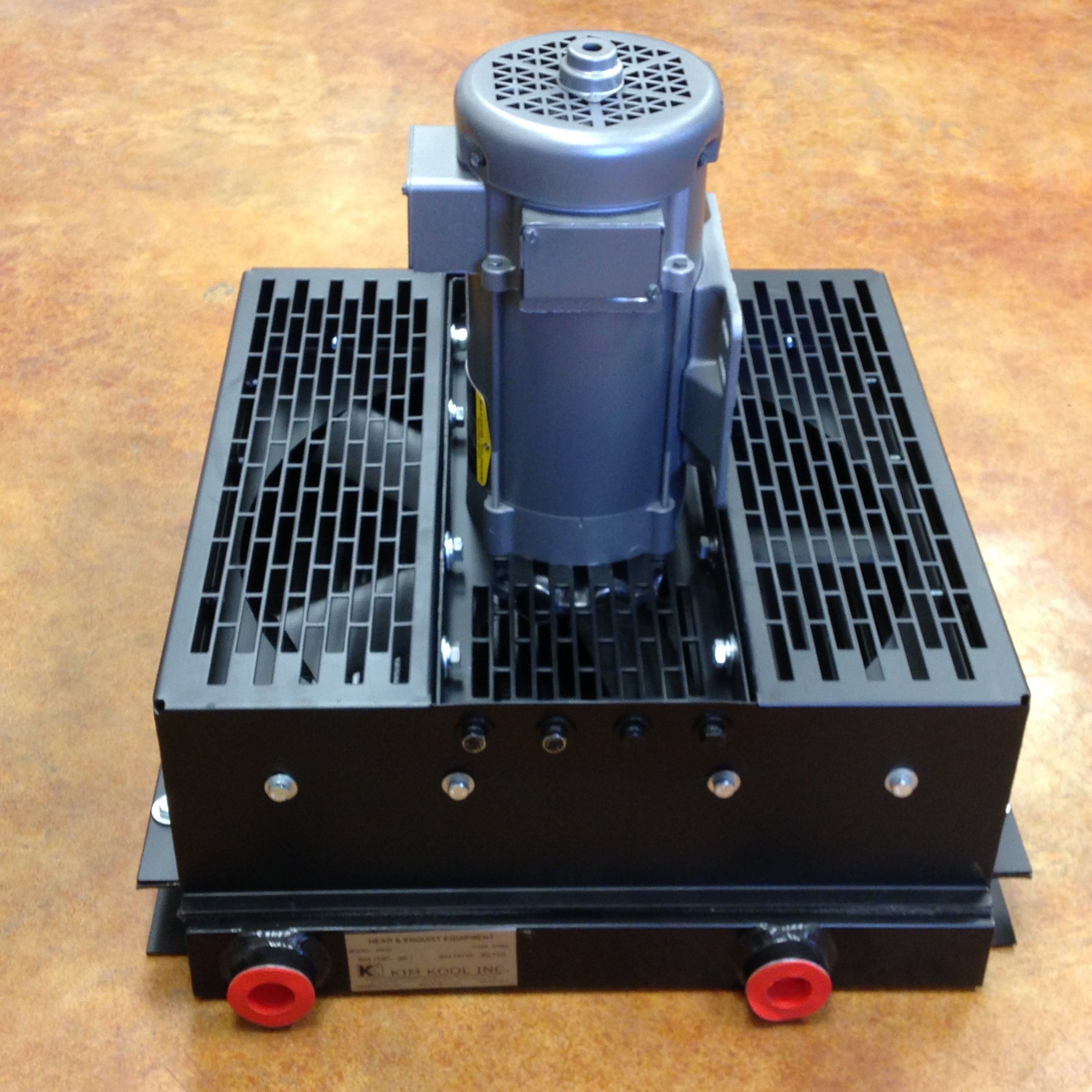  Aluminum oil cooler with 24 volt DC motor custom manufactured for auxilary cooling in a retrofit application. 