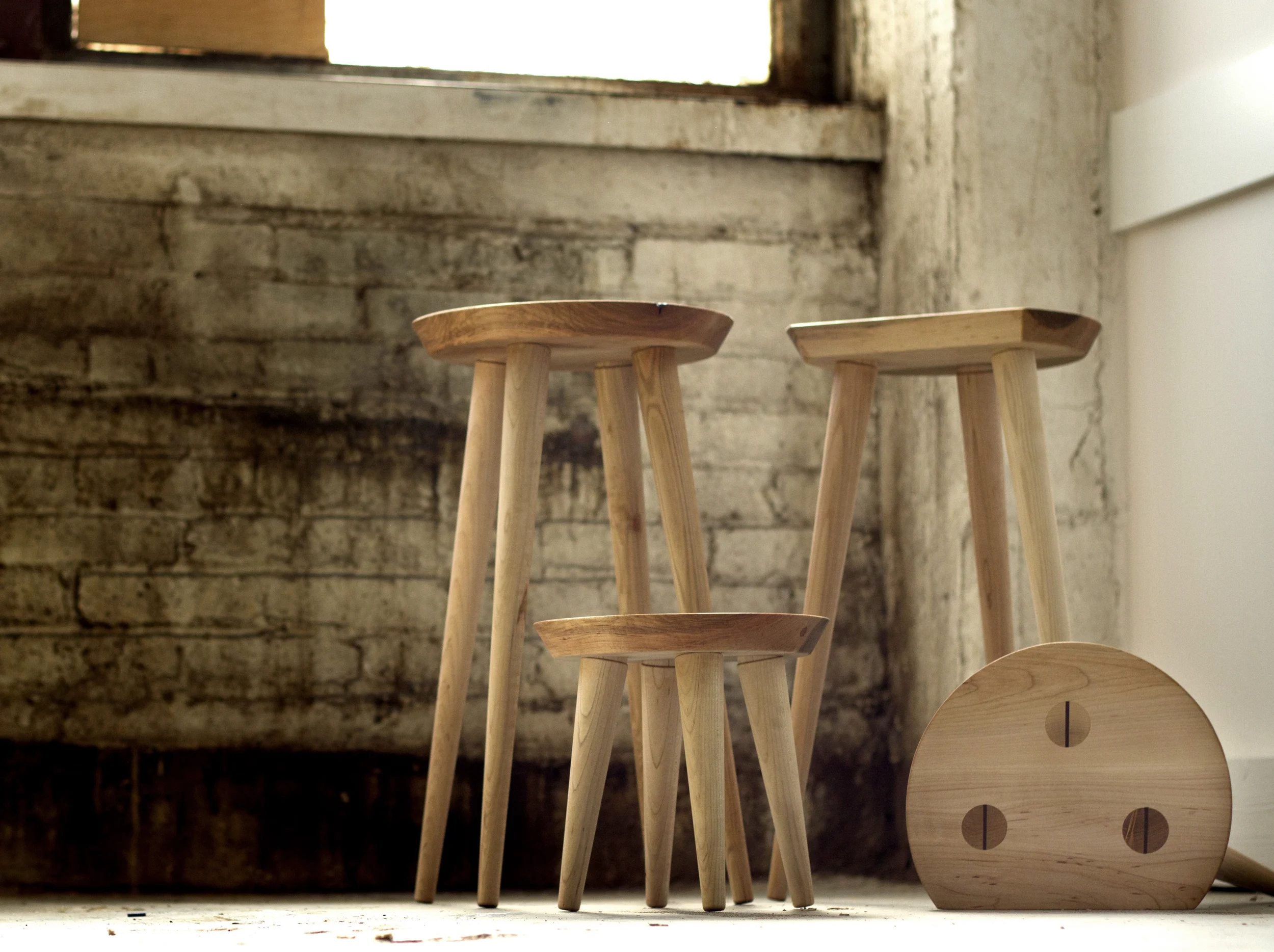 Custom designed Shaker-style maple display stools with wedged through tenon legs.