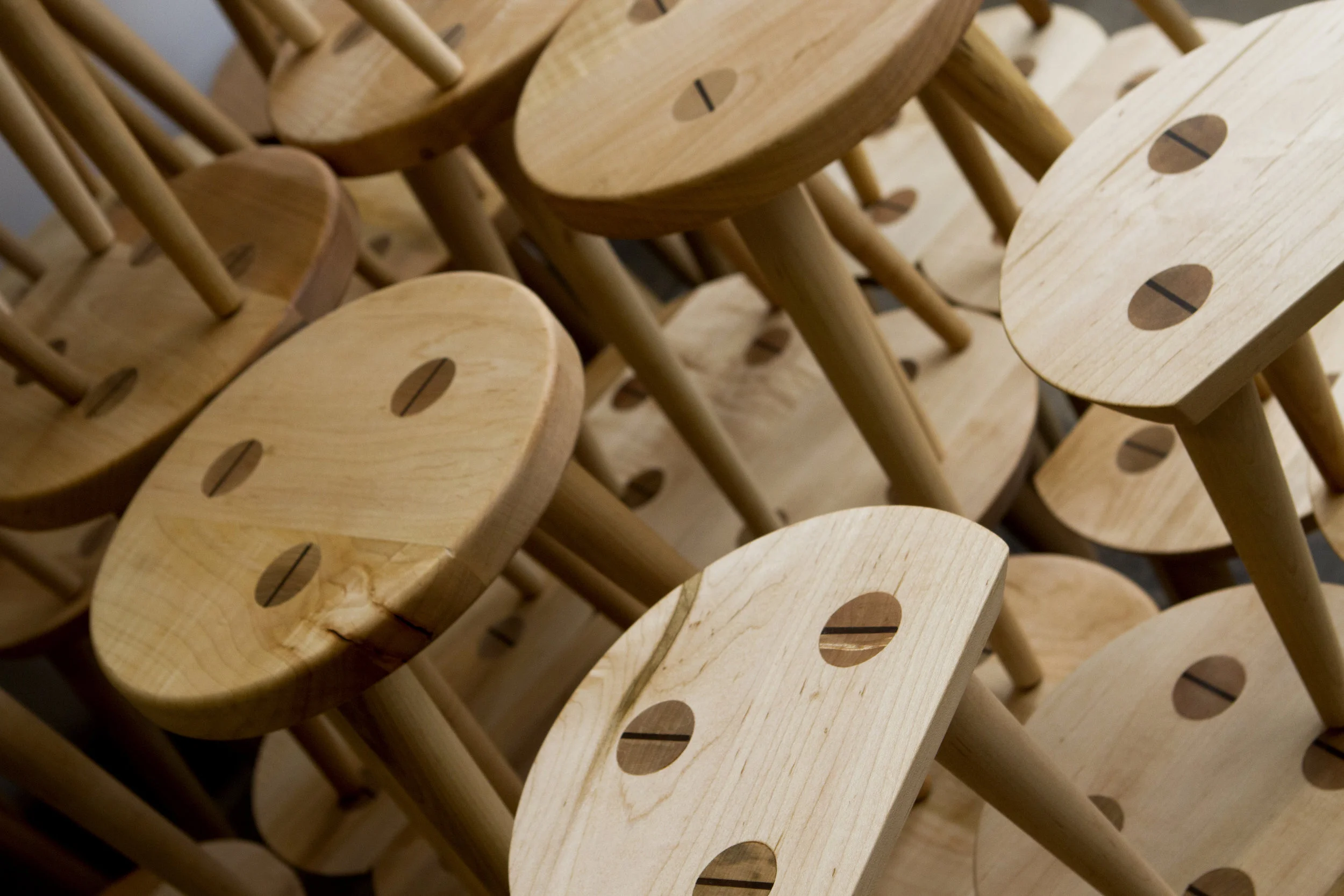 Custom designed Shaker-style maple display stools with wedged through tenon legs.