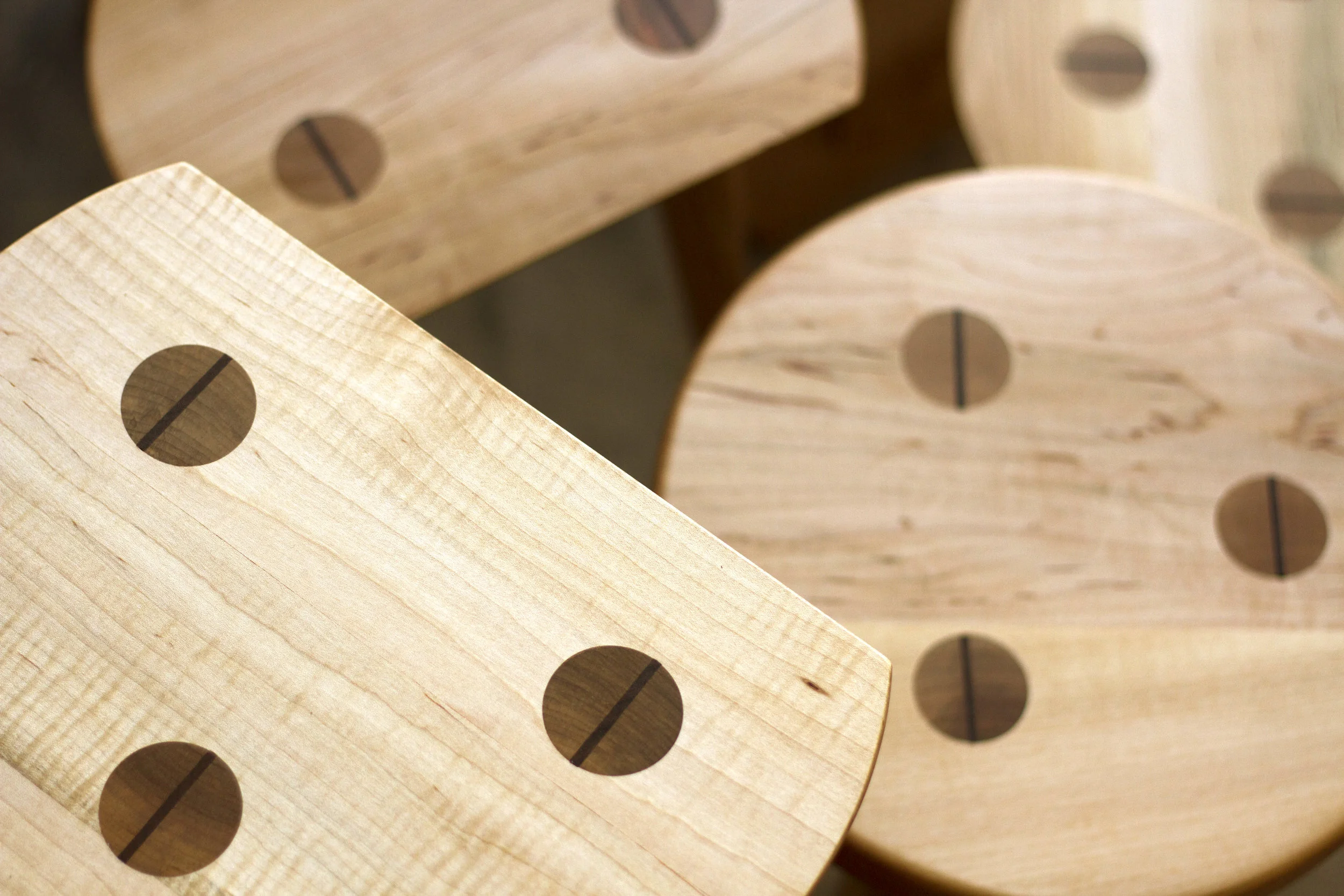 Custom designed Shaker-style maple display stools with wedged through tenon legs.