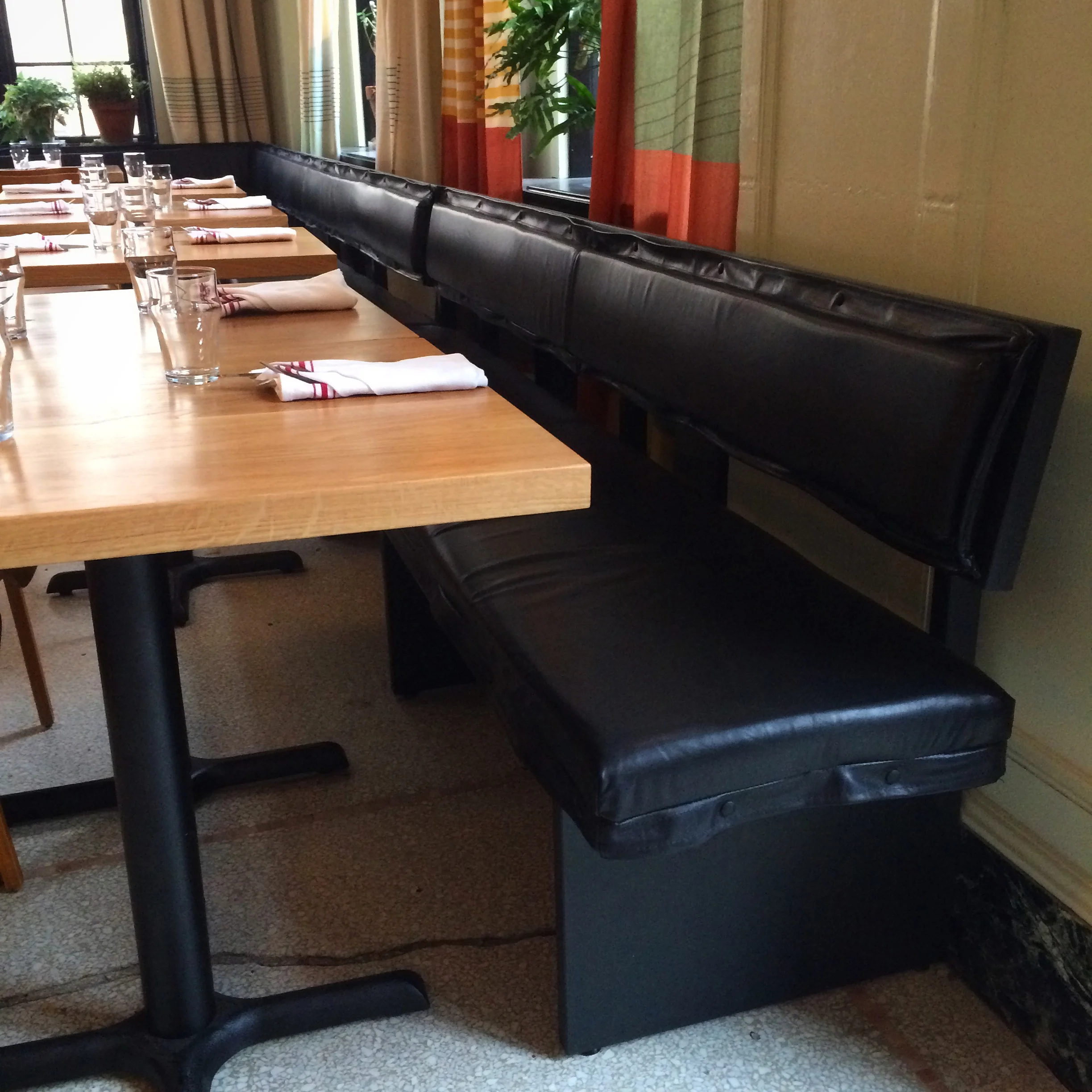 Custom oak dining tables and banquette benches