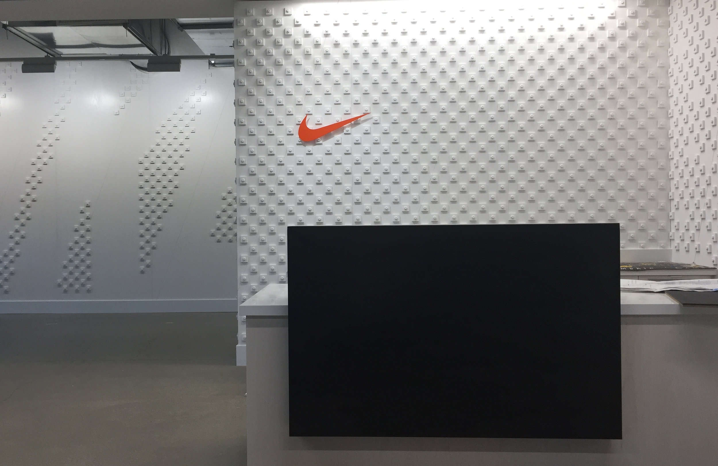 Custom bolt & pixel typographic wall installation for Nike Pittsburgh.