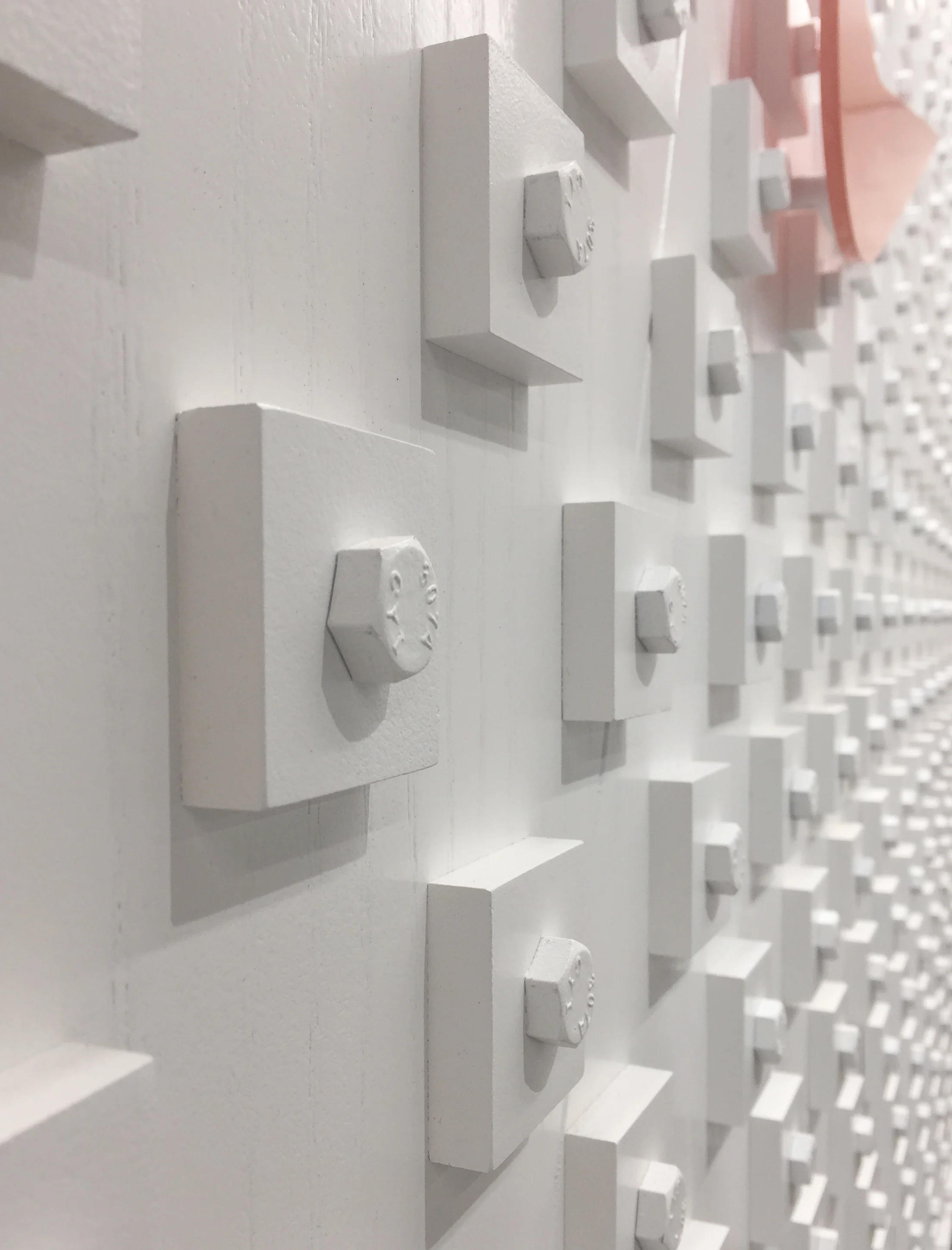 Custom bolt & pixel typographic wall installation for Nike Pittsburgh, pixel detail.