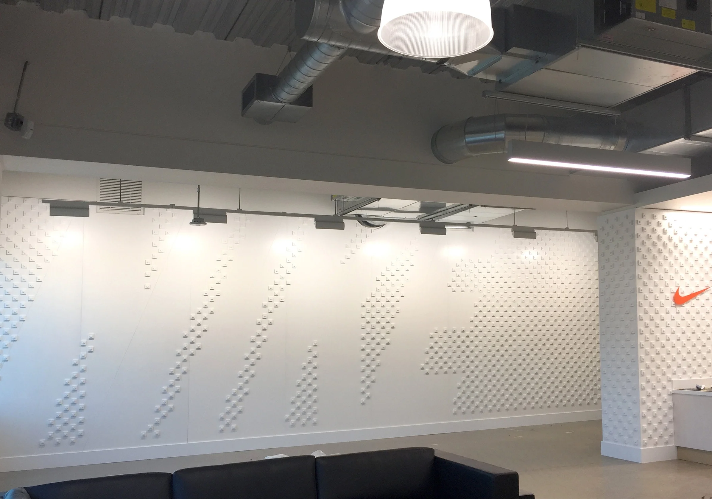 Custom bolt & pixel typographic wall installation for Nike Pittsburgh.