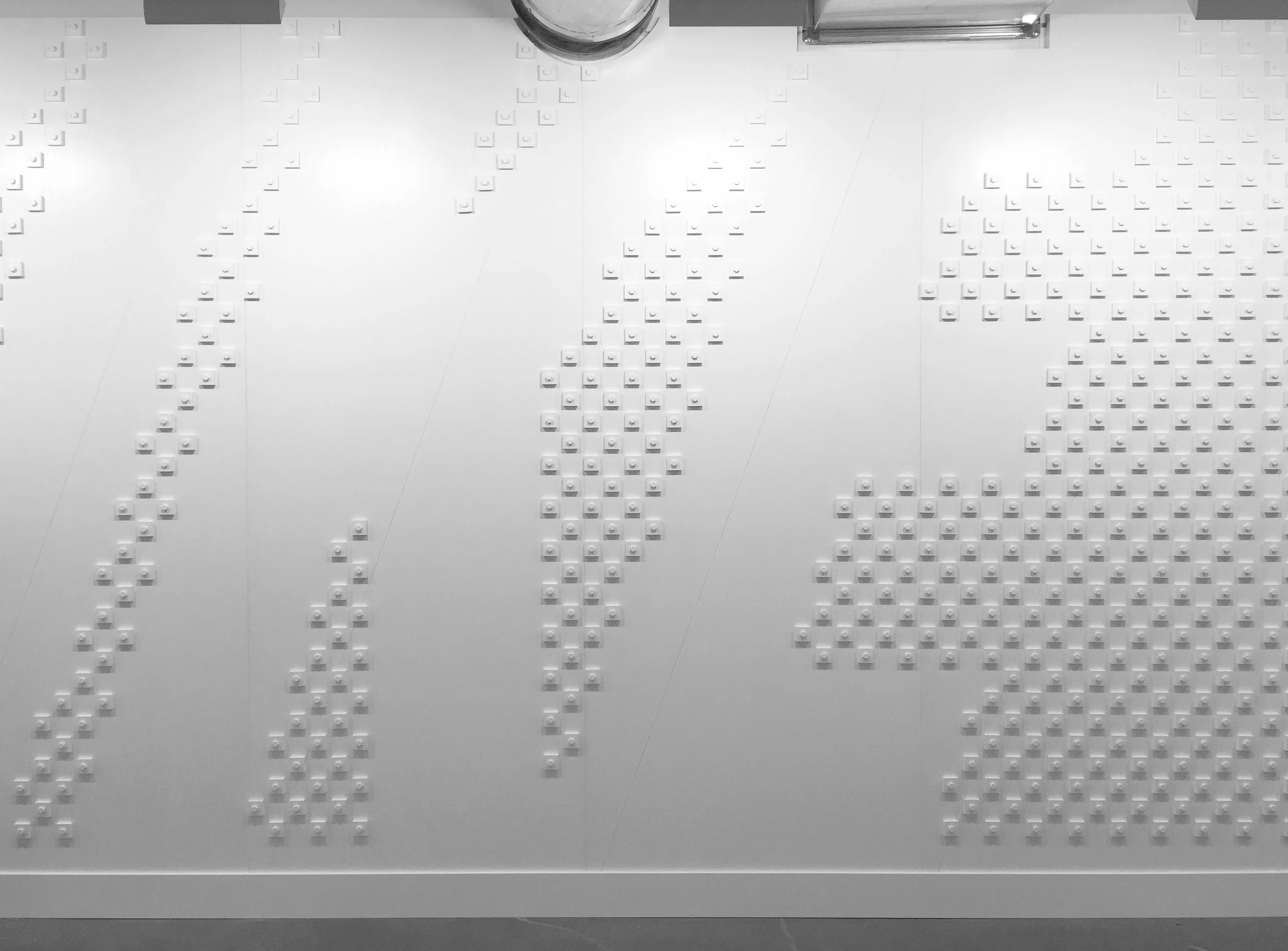 Custom bolt & pixel typographic wall installation for Nike Pittsburgh.