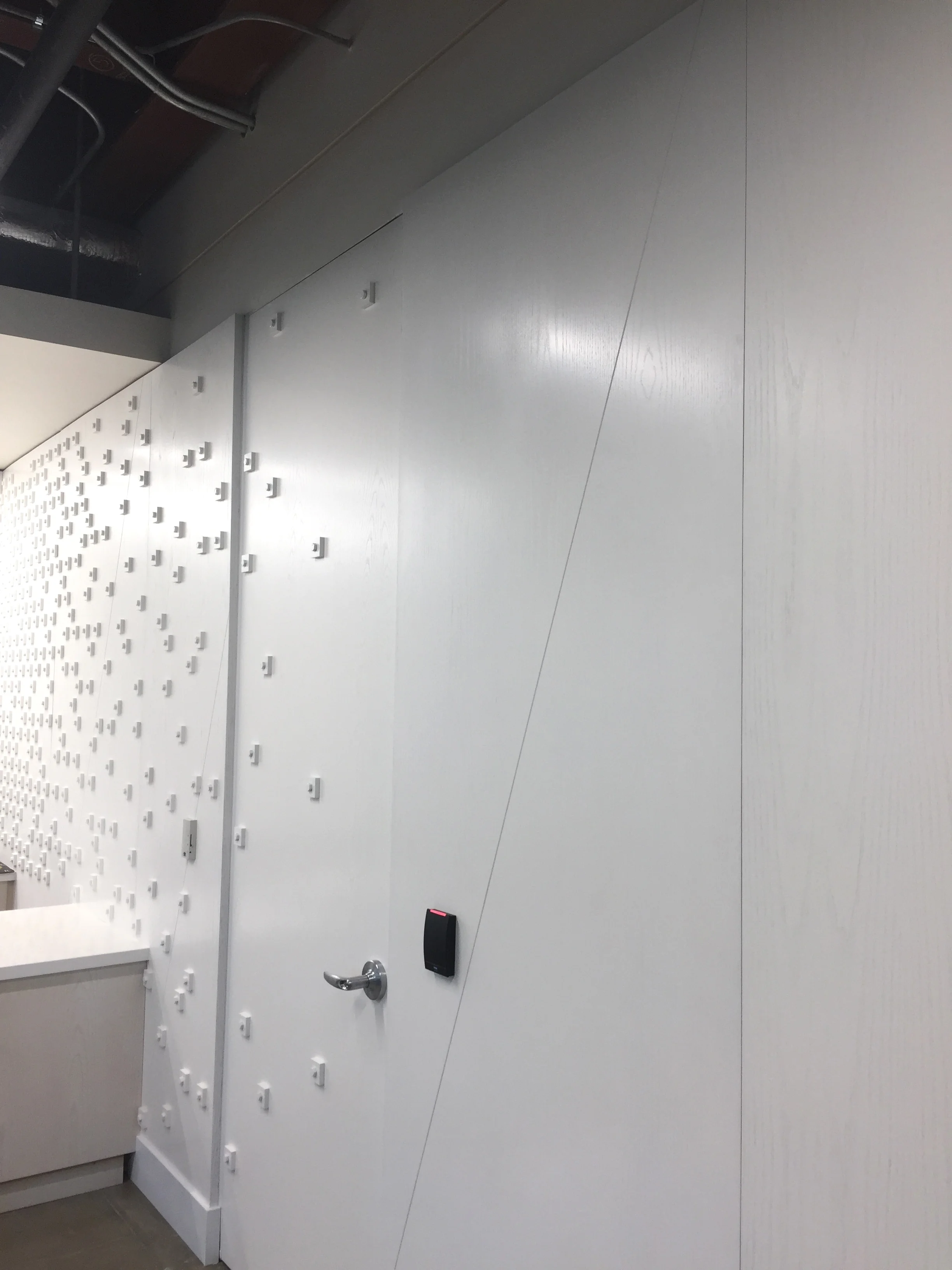 Custom bolt & pixel typographic wall installation for Nike Pittsburgh.