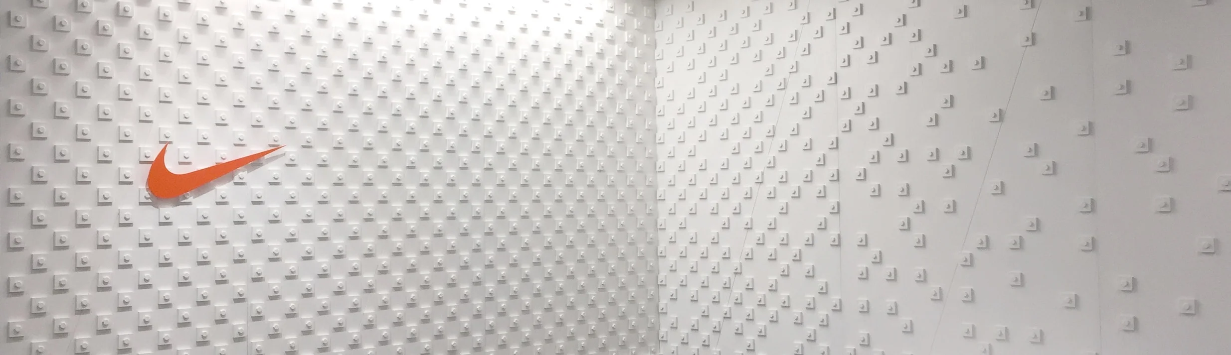 Custom bolt & pixel typographic wall installation for Nike Pittsburgh.