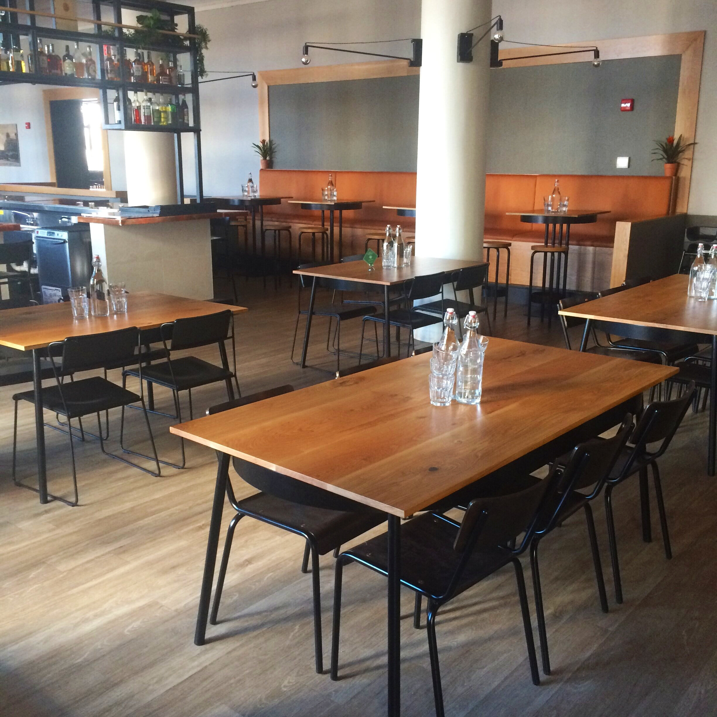 Custom designed white oak and steel dining tables.