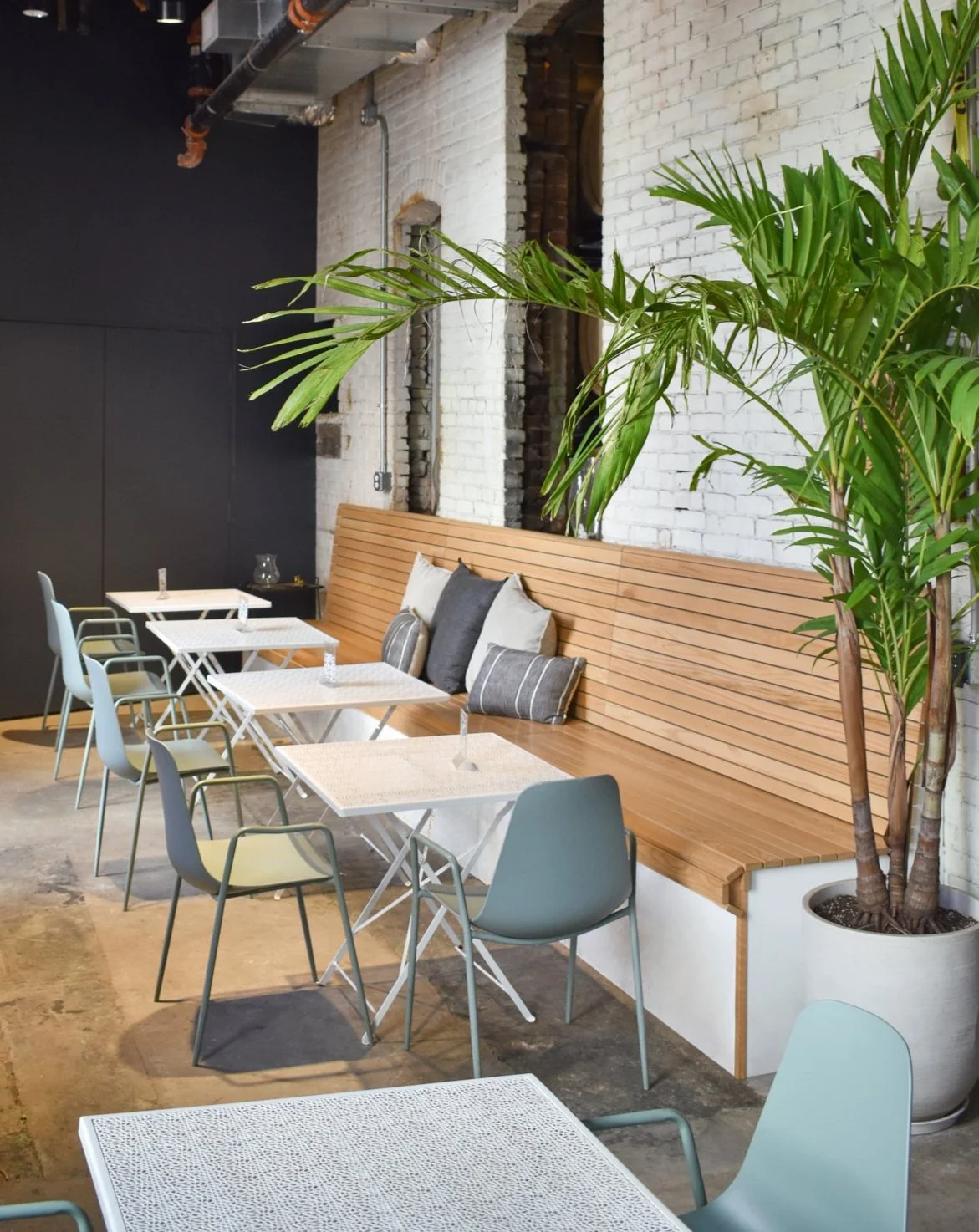 Custom red oak banquette seating with integrated storage.