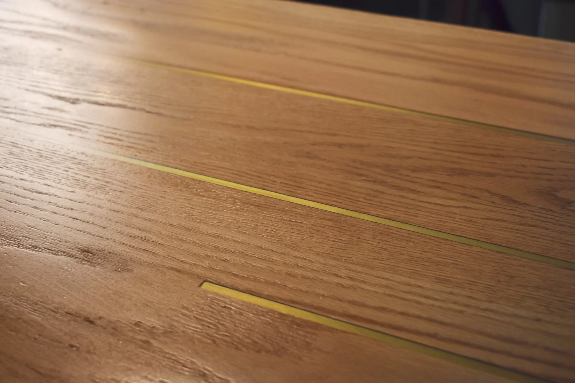 Custom red oak bartop with brass bar inlay.