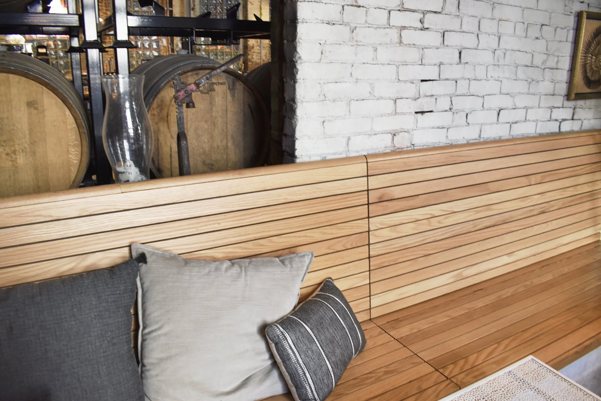 Custom red oak banquette seating with integrated storage.