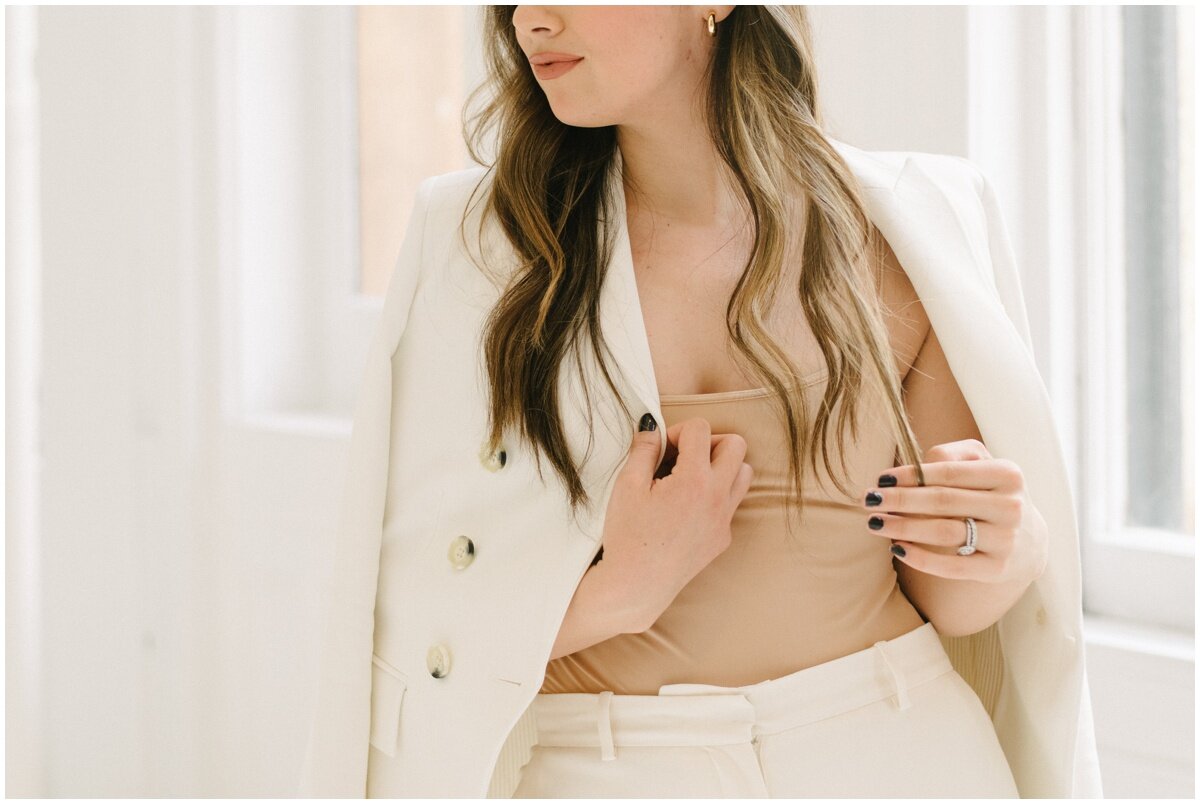  Brand photos of woman in white suit, nude tank 