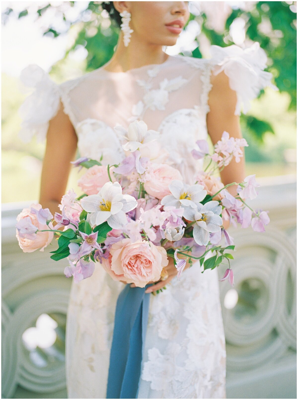  Bridal bouquet in pastel pinks and peaches, with cascading blue silk ribbon 