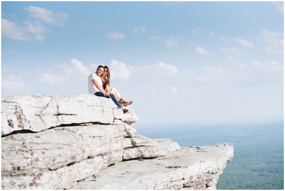 Couple sitting on rock ledge at Minnewaska State Park | NKB Photo