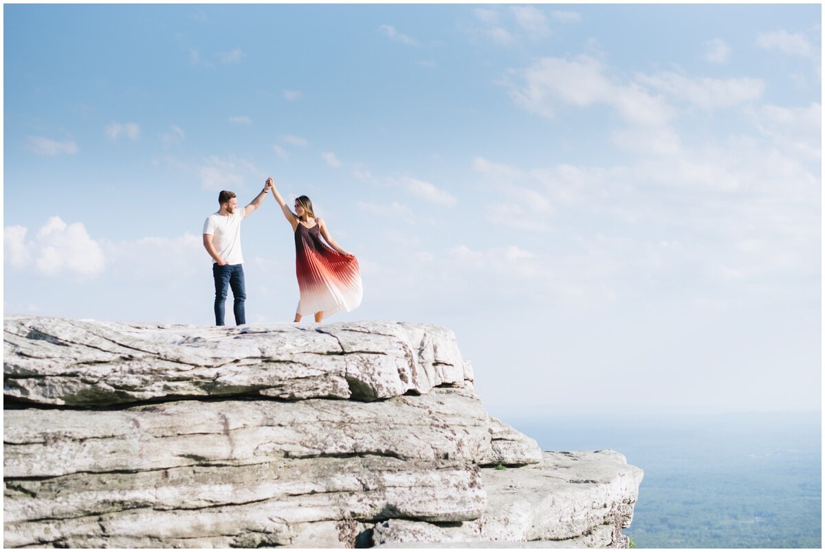 Man twirling woman during Minnewaska State Park engagement session | NKB Photo